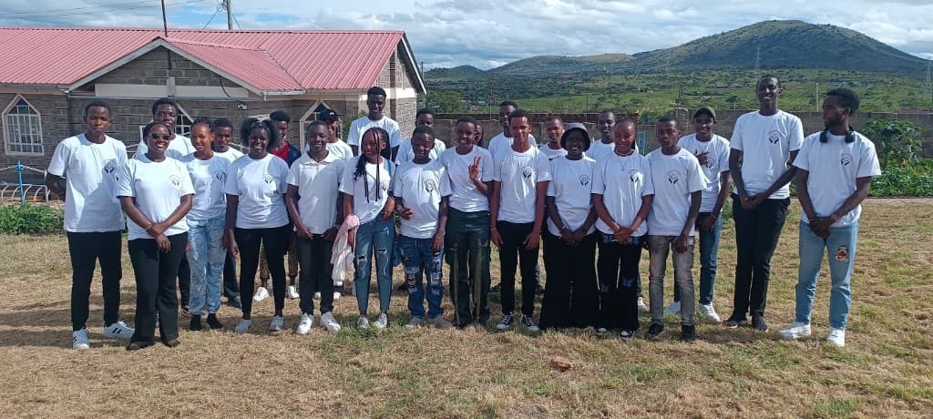 Union of Change members in matching shirts standing together outdoors